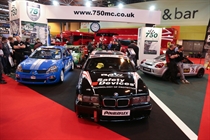 The front of the stand. BMW Compact Cup, Clio 182 Series and MR2 Championship cars in view.